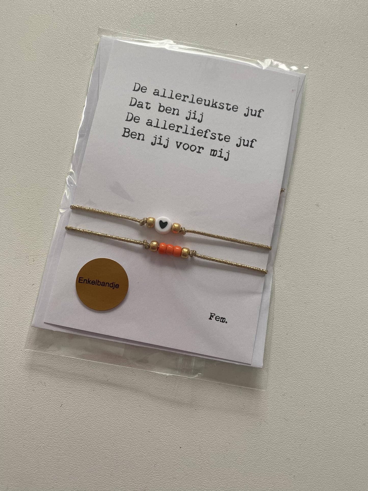 Papierpleziertjes: kaart met enkelband elastisch oranje
