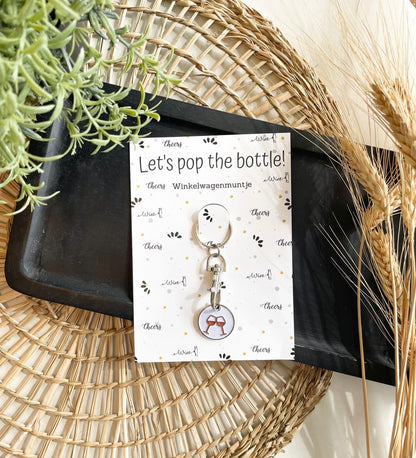The big gifts: Winkelwagenmunt/sleutelhanger - let's pop the bottle