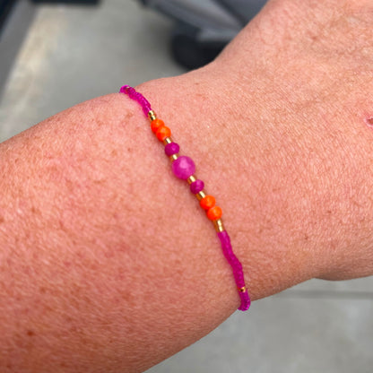 Armbandje op elastiek Miyuki kralen - oranje en fuchsia
